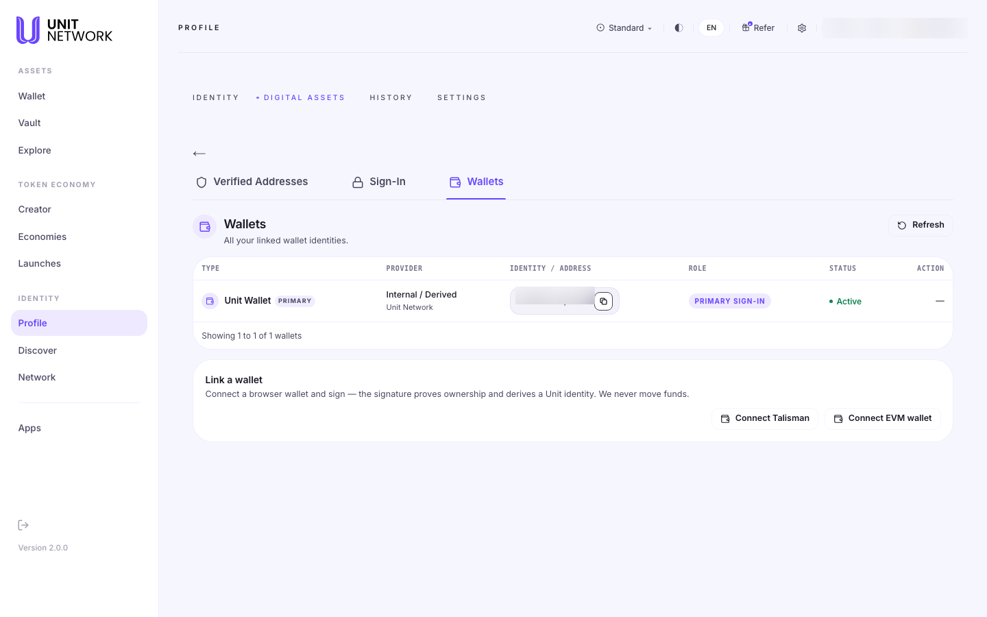 The Wallets section of Digital Assets, reached from Profile. A section headed "Wallets" reads "All your linked wallet identities" with a Refresh control. A table with columns TYPE, PROVIDER, IDENTITY / ADDRESS, ROLE, STATUS and ACTION lists one entry: Unit Wallet marked PRIMARY, provider "Internal / Derived — Unit Network", with the role PRIMARY SIGN-IN and status Active. Beneath, a "Link a wallet" section reads "Connect a browser wallet and sign — the signature proves ownership and derives a Unit identity. We never move funds", with Connect Talisman and Connect EVM wallet controls. The account pill and the wallet address are blurred.