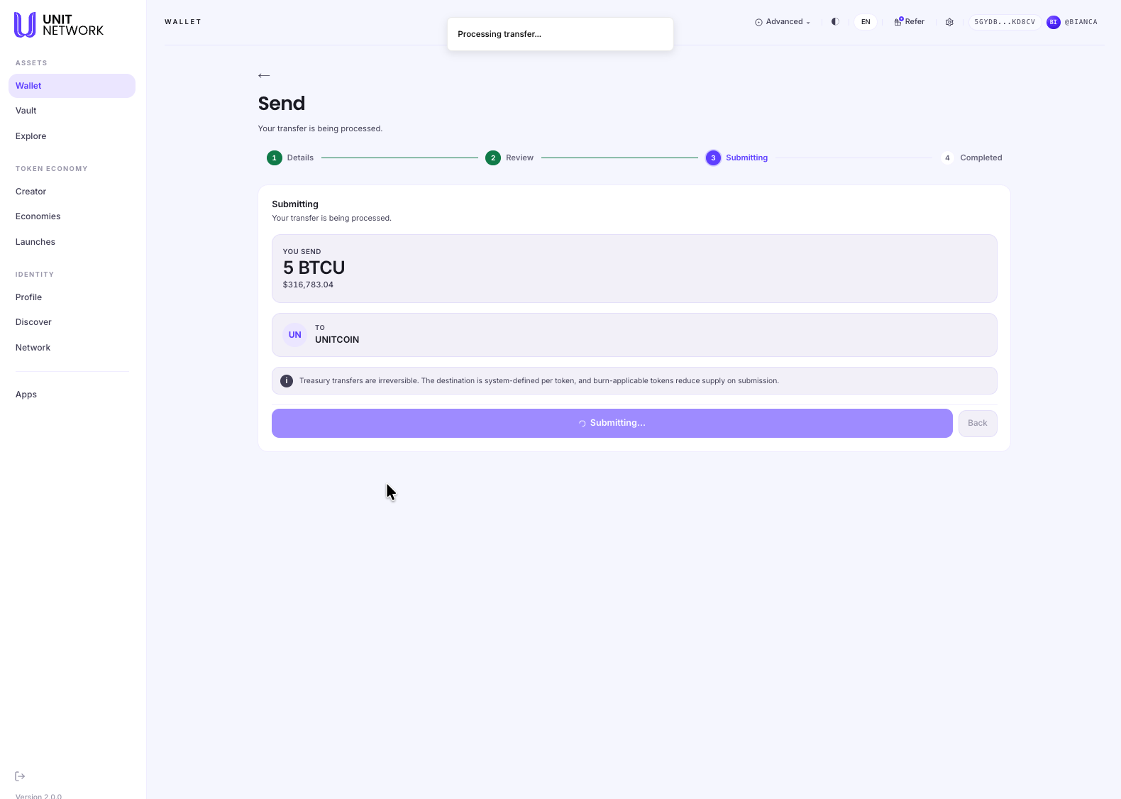 The Send screen at the Submitting stage. The step bar shows Details and Review complete and Submitting active. The panel is headed "Submitting — your transfer is being processed" and repeats the amount, 5 BTCU, and the destination. The primary button now reads "Submitting…" with a spinner and is disabled, and the Back button beside it is greyed out. A small notice at the top of the screen reads "Processing transfer…".